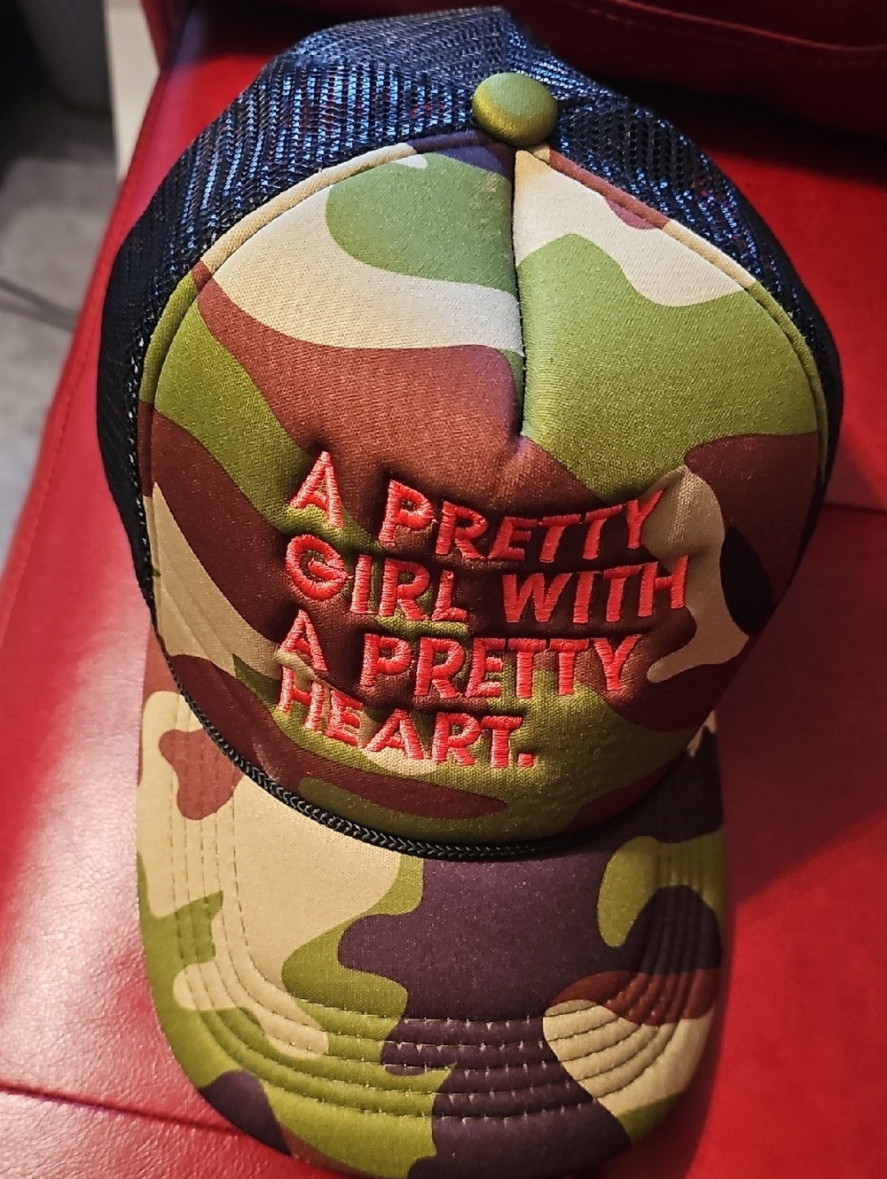 Camo Trucker Hat with Red Embroidered Slogan